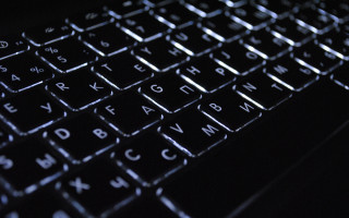 Keyboard black background white letters - a close up of a keyboard free wallpaper