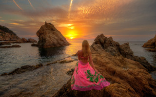 Pink dress woman ocean sunset - the sun setting behind her free wallpaper
