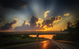 Sunset highway bridge clouds cars - crepuscular ray free wallpaper
