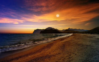 Beach sunset mountain city lights - over the water free wallpaper