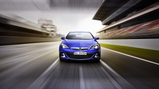 Blue car street tall buildings - a blue car free wallpaper