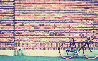 Bike parked brick wall street - a street corner free wallpaper