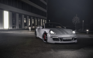White sports car night parking 4 - a building in the background free wallpaper