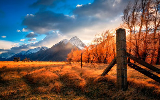 Fence field mountains cloudy sky - in a field free wallpaper