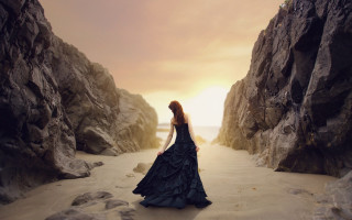 Woman black dress cave beach - rock and water free wallpaper