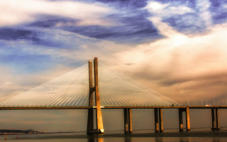 Bridge water clouds sunset reflection - the background and a boat free wallpaper