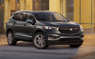 Black buick suv yellow building - dick bickenbach free wallpaper