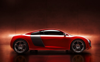 Red sports car dimly lit - a black stripe free wallpaper