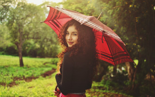Woman holding red umbrella park - the background and grass free wallpaper
