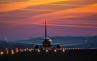 Large jetliner runway dusk city - top of an airport runway free wallpaper