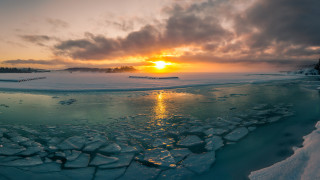 Frozen lake sunset ice chunks - a sunset over a free wallpaper