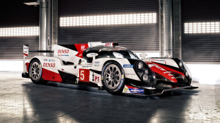 Racing car garage roller door - a large window behind free wallpaper