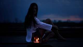 Woman sitting lantern candle night - atmospheric lighting free wallpaper