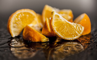 Sliced orange water droplets still - a table top free wallpaper