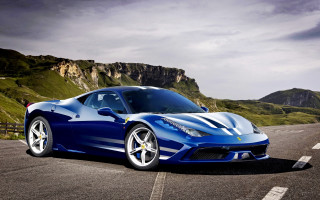 Blue sports car mountainous road - a mountain range in the background free wallpaper