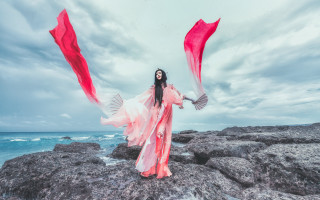 Woman long dress ocean rocks - elsa bleda free wallpaper