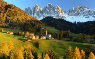 Mountain village autumn leaves church - tree and mountains free wallpaper