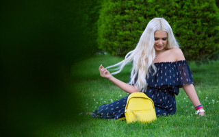 Blonde woman sitting grass yellow - the grass free wallpaper