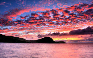 Sunset mountains water clouds city - a beautiful sunset over a mountain range free wallpaper