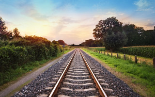 Train sunset trees grass cityscape - a train track free wallpaper