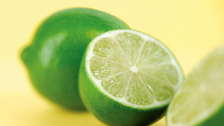 Lime halved on yellow surface - a yellow surface free wallpaper