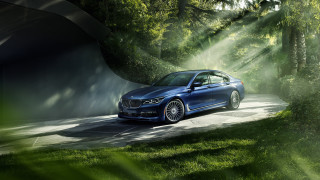 Blue car forest road rimlight - a blue car free wallpaper