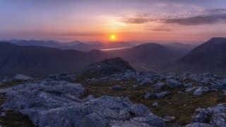 Sunset mountain lake river shore - a sunset over a mountain range free wallpaper
