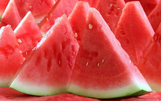 Watermelon slices green stem summer - a close up of a bunch free wallpaper