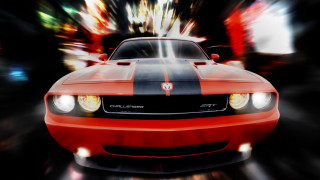 Red car driving street headlights - a blurry background free wallpaper for desktop
