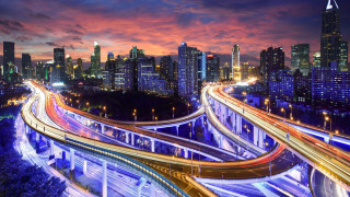 City skyline highway bridge night - a city skyline in the background free wallpaper