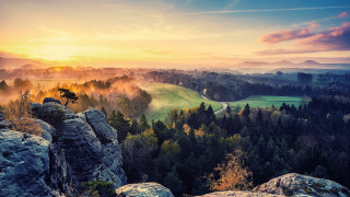 Scenic valley mountains trees sunset - a scenic view of a valley free wallpaper