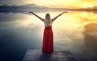Woman dock red dress outstretched - woman free wallpaper