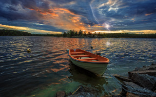 Sunset boat water rock sky - dramatic free wallpaper