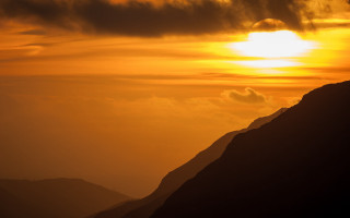 Bird sunset mountain ocean sky - a sun free wallpaper