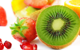 Kiwi strawberries oranges fruit closeup - arcimboldo free wallpaper