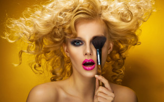 Woman makeup brush yellow background - a brush free wallpaper