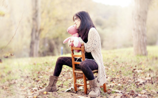 Woman sitting chair teddy bear - a chair holding free wallpaper