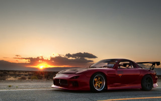 Red sports car sunset clouds 2 - a red sports car free wallpaper