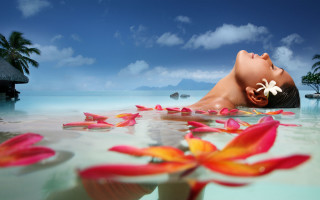 Woman floating flowers water blue - closed free wallpaper