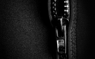 Zipper open black jacket macro - a white line free wallpaper