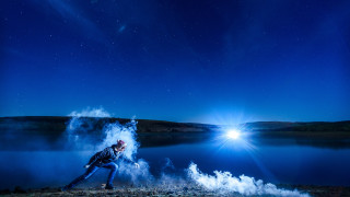 Man running field bright light - anamorphic free wallpaper