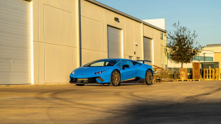 Blue sports car building tree - side profile free wallpaper