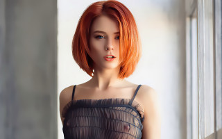 Red hair woman window sill - a curtain behind her free wallpaper