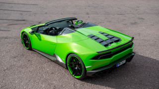 Green sports car parking lot - a green sports car free wallpaper