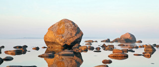 Large rock water beach pebbles - a large rock free wallpaper