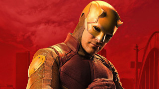 Man yellow red costume red - a red sky behind free wallpaper