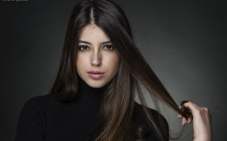 Woman pony tail black sweater - head and shoulders portrait free wallpaper