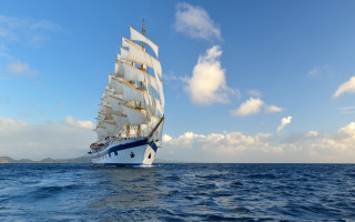 Sailboat ocean sunny clouds beach - boleslaw cybi free wallpaper