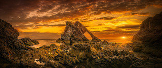 Beach sunset rock formation ocean - david paton free wallpaper