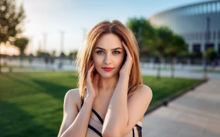 Woman posing park hands face - her cheek free wallpaper